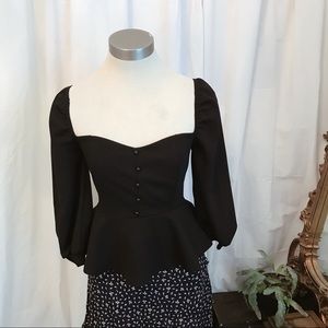 Black Bardot top with puff sleeves and peplum